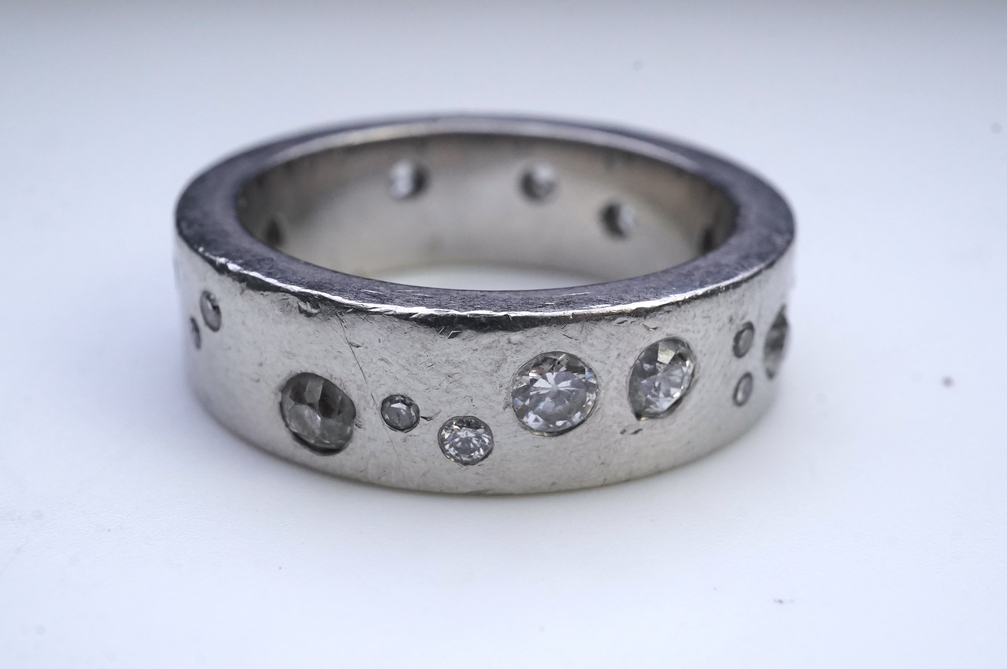 A platinum and diamond eternity ring